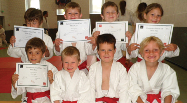 Eight students receive their Mon's grading certificates