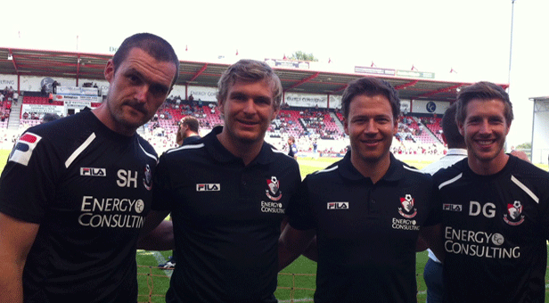 Image: Tom (2nd from left) and Dayne (3rd from left) posing with the AFCB team