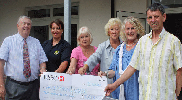 The cheque is presented to Elizabeth Purcell, CEO of the Lewis Manning Hospice (second from right), by representatives of the five local Rotary clubs (clockwise from left): Roy Salmon (Wimborne), Linda Winter (Swanage & Purbeck), Hazel Hatch (Parley) , Anne Banks (Ferndown) and John Perry (Wareham).