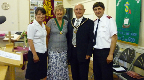 Captains Gia and Eka along with the Verwood Mayor Councillor Peter Richardson and the Mayoress Mrs Rosemary Richardson at their induction by Major Howard Webber