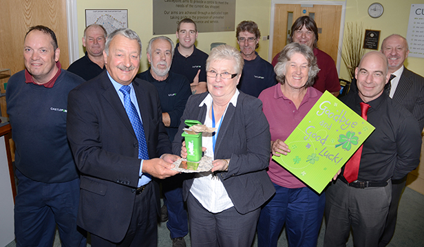 Peter Mathews presents Leslie Garcia the green bin trophy