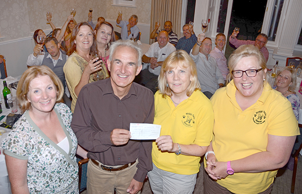 PamPurredPets’ Charlotte Sturmey and Steve Fowler present cheque to Waggy Tails’s Chrissie Davies and Sally Troth at the Moorhill House Hotel