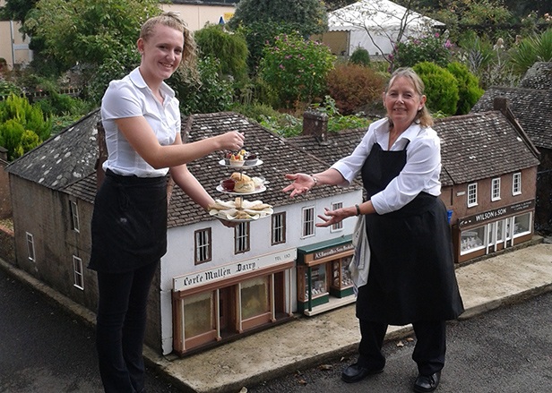 Olivia Row (LEFT) & Marion Bailey (RIGHT) with high tea in the Model Town Square