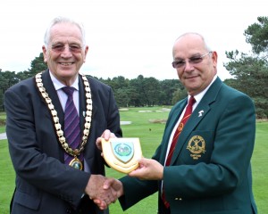 The mayor presents a plaque to Ferndown Golf Club captain Barry Vincent