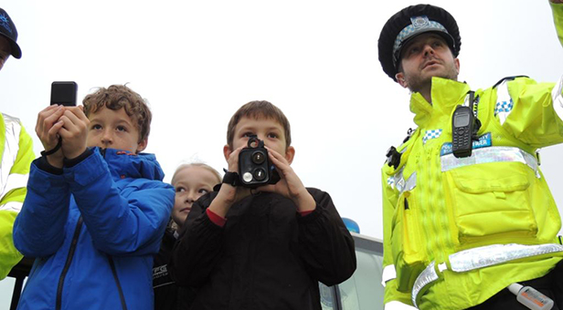 Police Community Support Officer Mike Sinnick with students from Archbishop Wake School