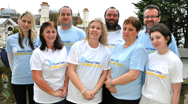 Round Table Children's Wish Director Karen Winchcombe, centre, with staff and trustees in wearing T-shirts with the new design on.