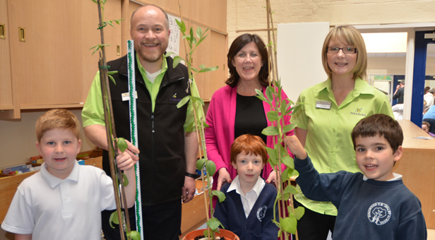 (Front from left) Beanstalk competition winners Tyler, Rebecca, and Tom with (Top L - R) Haskin’s David Brown, Head Teacher Hilary Silk and Joolz Walford