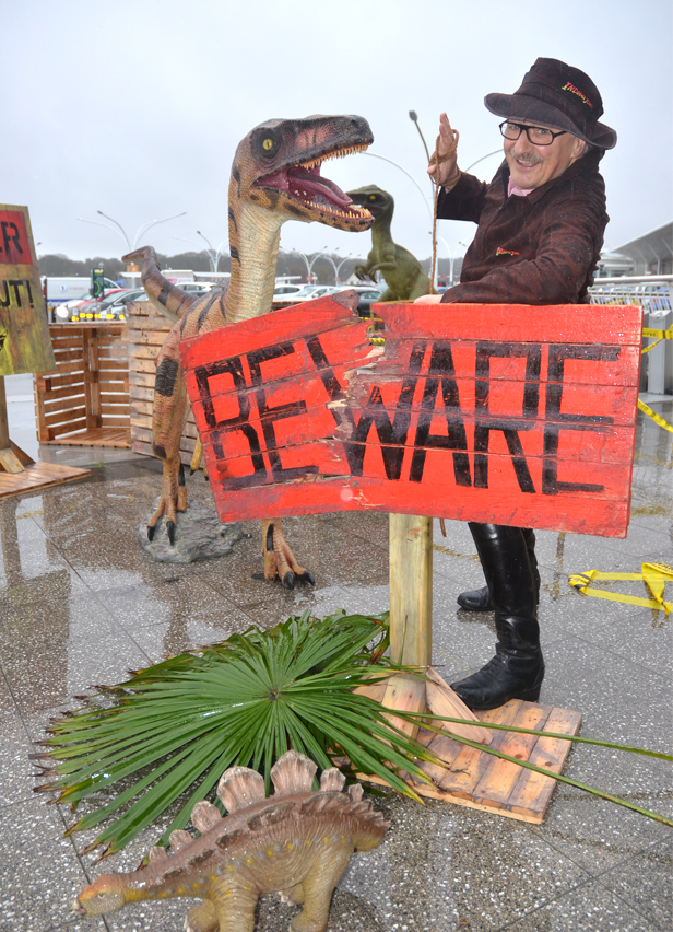 Peter (Indiana) Matthews with the un-crated velociraptor and the baby stegosaurus that is one of the dino hunt competition prizes.