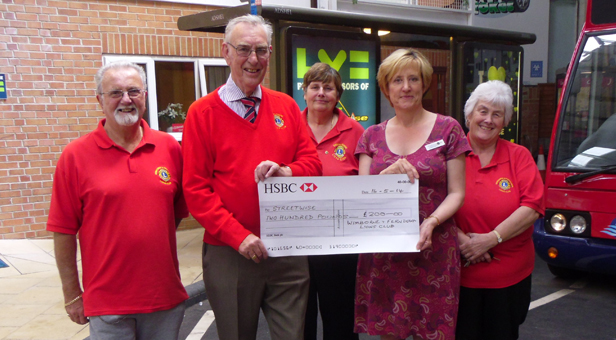 Barry Duxbury, Anne Lippitt and Joan Budden with Ken Taylor handing the cheque to Diana
