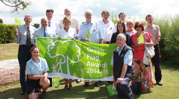Representatives from Borough of Poole celebrating Poole Park's Green Flag