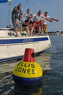 Mad about the buoy: Ellis Jones partners, including Nigel Smith, Managing Partner (second right), inspect the Ellis Jones' buoy in Poole Harbour