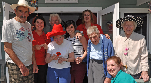 Tribute: Staff and residents at Colten Care's The Aldbury who held a poppy picnic to mark the 100th anniversary of Britain joining World War One