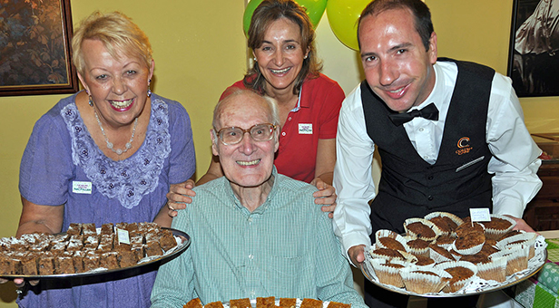 John Griffiths a resident at Colten Care's Canford Chase with (left to right) Sylvie Craig-Swainson, Maria Grant and Mark Newell
