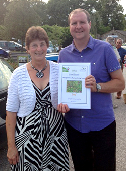 Jan Ayrton, President of Creekmoor with Oakdale WI and Ray Alderton, Poole Culture Volunteer with the second place certificate