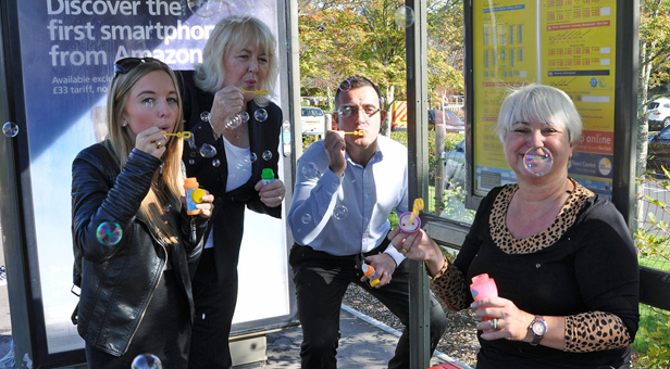 Jenni Wilkinson, right, and other Yellow Buses staff, blow bubbles for IPF.