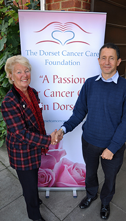 GENEROUS HANDSHAKE: DCCF Chairman Pam Jeffries thanks Steve Blonstein for his six-figure donation.