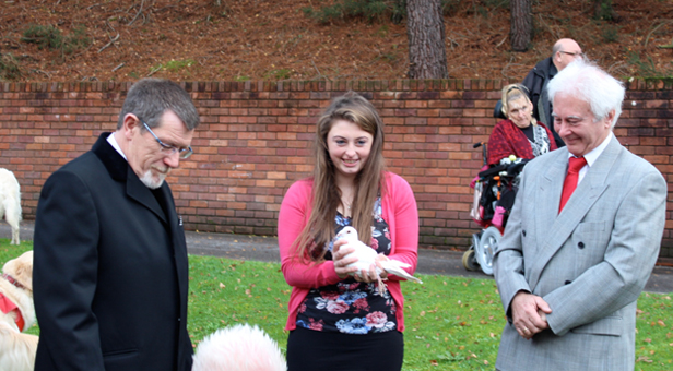 Sarah with a dove just before she and her father Andy released one each as a final farewell