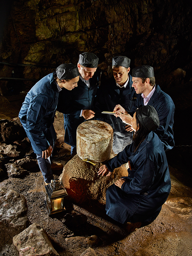 Wookey Hole provides an atmospheric back drop for the grading of Wookey Hole Cave Aged Cheddars for Christmas. The Cheddars, which are stored in 27kg wheels take around nine months to mature and assume the full, earthy, nutty flavour of the Caves.