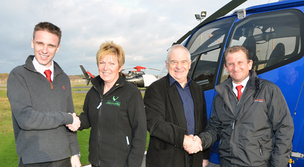 Ollie Pennington welcomes Linda Thornton with Peter Thornton and ground school instructor Ian Brookes.