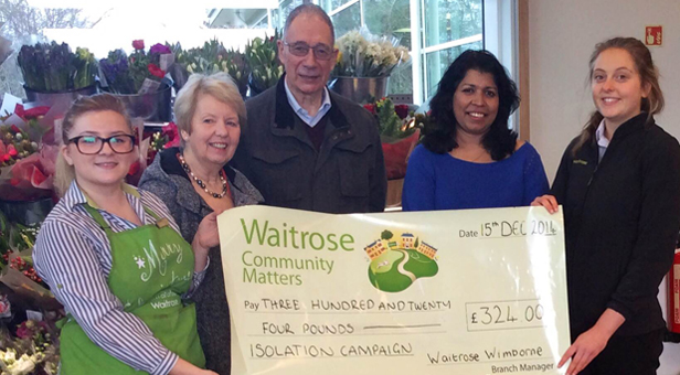 Lynne and John Ewins receive a share of community sponsorship funds from Alison Good, Local Co-Ordination Manager at Waitrose