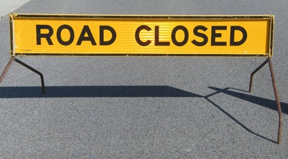 Sign with the words Road Closed written on