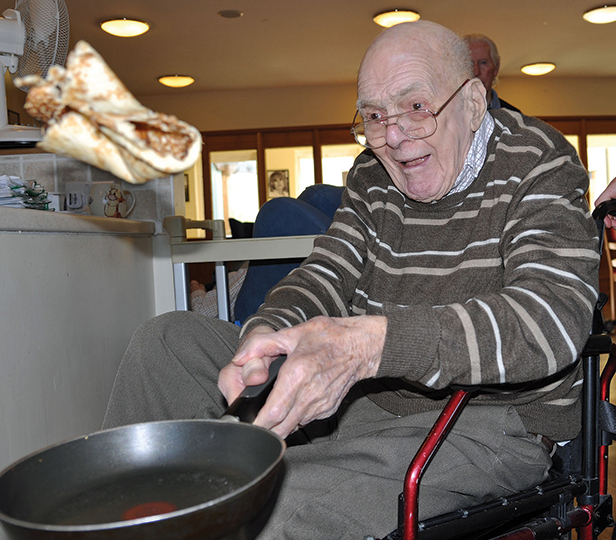 George Collins, 91, a resident at Colten Care's The Aldbury, takes part in the home's pancake time trial