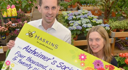 Matt Hill (left) presents the £4626 cheque to Jo Malyon on behalf of customers and staff