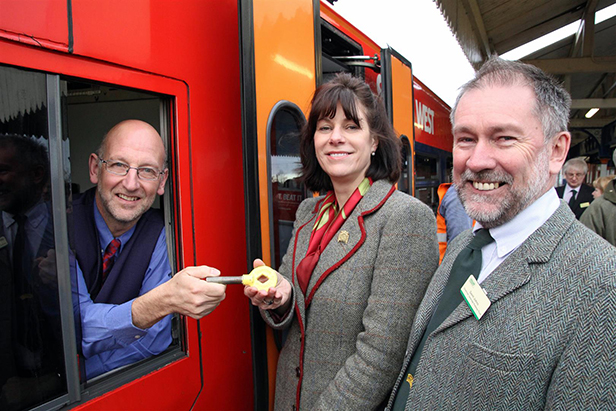 Driver Pete Burton & Claire Perry with key token & Gavin Johns