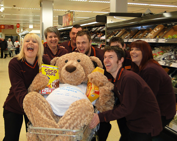 Lewis Bear with staff at Sainsbury's Poole