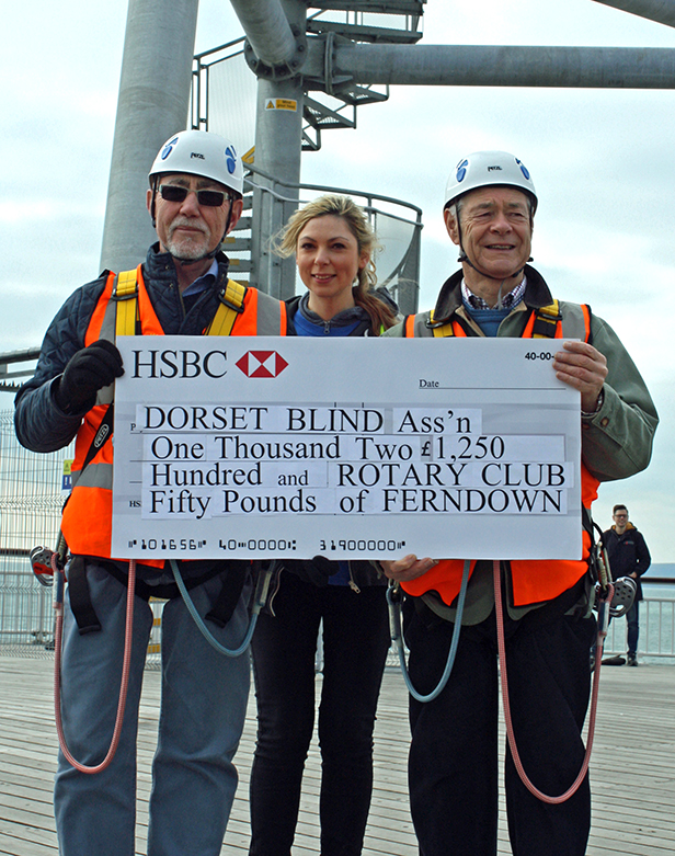 Gordon Lewis (left) and Derrick Powell, both from Ferndown Rotary club, present the cheque for £1250 to Jaya da Costa, fund raising manager at the Dorset Blind Association.