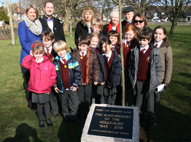 Holocaust memorial unveiled: (back row from left) Head of The Priory School Claire King, Revd Richard Partridge, Dr Josie Lipsith, The Mayor Cllr Denise Jones, Rabbi Adrian Jesner and Bilha Weider with (in front) children from The Priory School