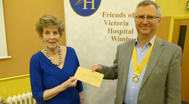 President Elect Alan Griffiths presenting cheque to Rae Cotton