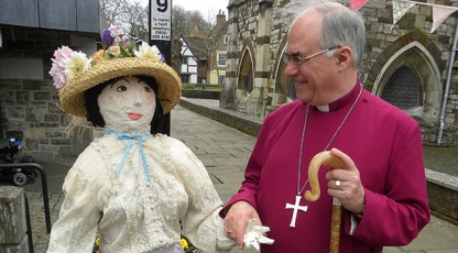 The Bishop of Sherborne is welcomed to the Coffee Morning by ‘Matilda’, one of the papier maché figures that will be on show at the flower festival