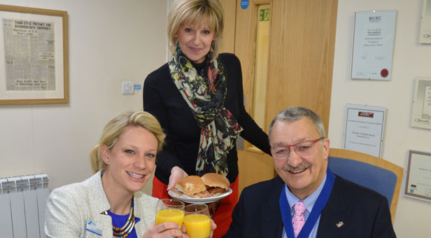 Castlepoint’s Management Suite Administrator Tanya Hatcher (centre) serves Emily Pike and Peter Matthews their brekkie