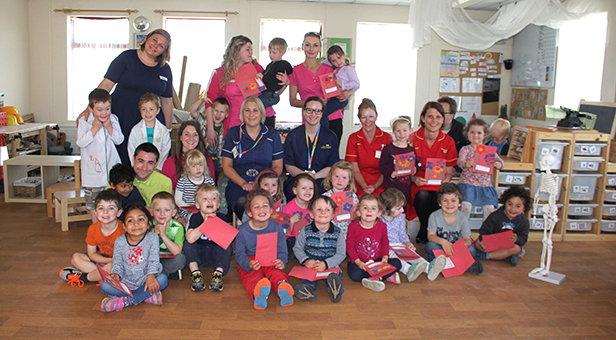 Children from Tops Day Nursery in Bournemouth present their cards to nurses