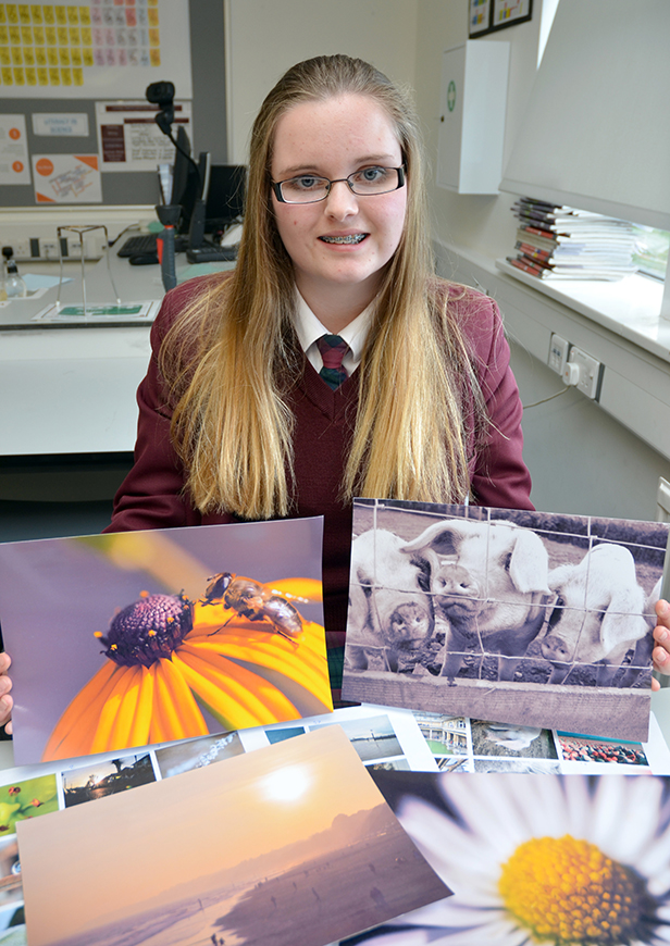 Molly Annett with a small selection of her fundraising photography