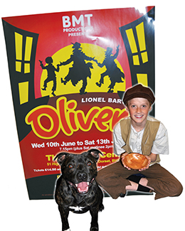 Matthew Trach, 12, (playing Oliver) with Higgins, one of the dogs hoping to get his teeth into the role of Bullseye