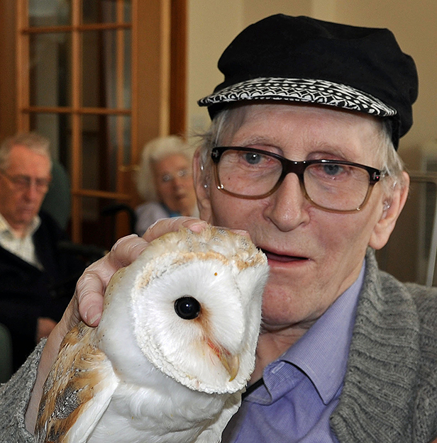 Feathered friend: Derek Coles, a resident at Colten Care's Amberwood House, meets barn owl Luna