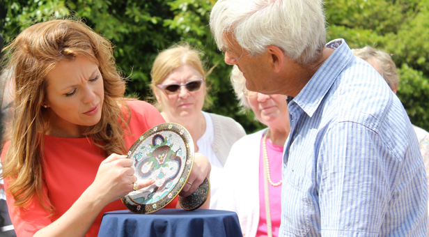 Christina Trevanion gives a valuation, seen here with the pedestal plate's owner David Parker 