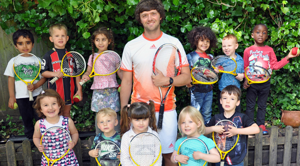 Tennis coach Will Bound with some of the children from the Bournemouth Day Nursery