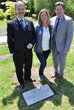 Malcolm Green, Kate Cross and Mark Alder, with the Purbeck stone memorial.