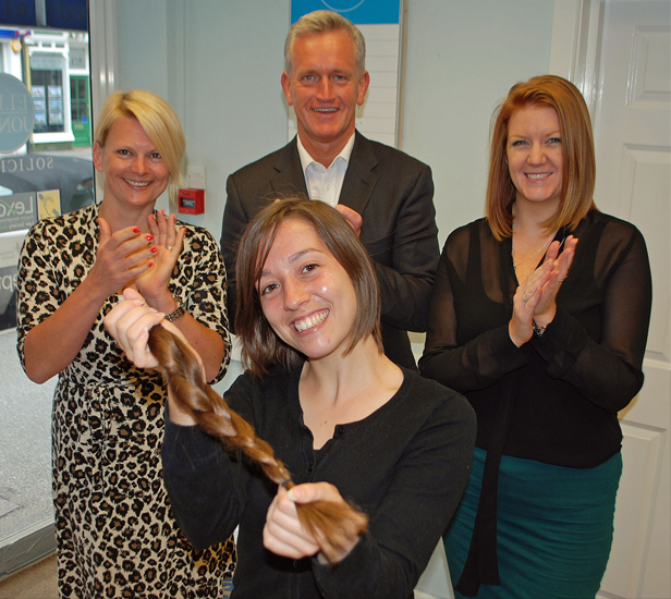 ...Gone tomorrow: Colleagues at Ellis Jones' Canford Cliffs office applaud Annie after she donates ten inches of her hair to the Little Princess Trust