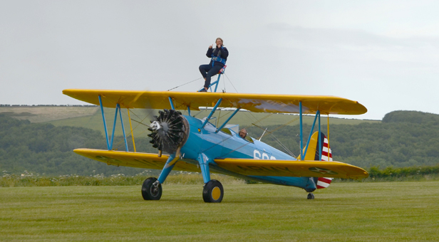 Tanya Hatcher on the top wing of the Stearman biplane