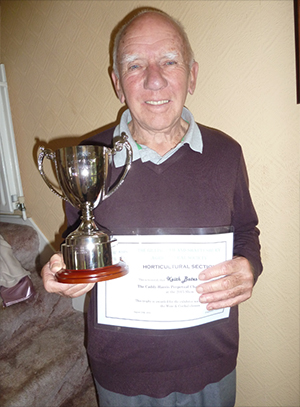 Keith Bates with his trophy and winning certificate