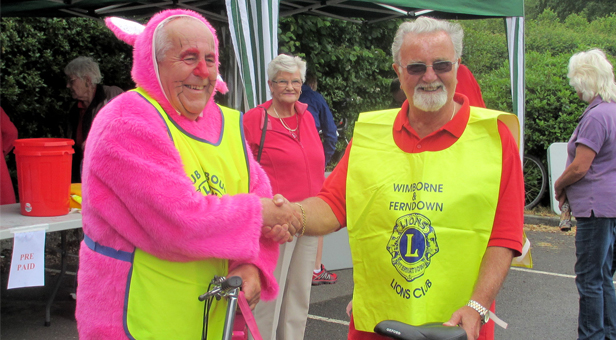 W&F president Barry Duxbury with Bournemouth Lions president Barrie Haynes in rabbit suit