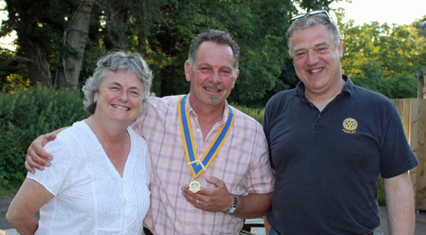 The new president of Parley Rotary Club, Shane Dart (centre), pictured with outgoing president Paul Du Lieu and Dorset district governor Debbie Dunford.