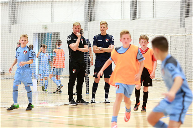 Eddie Howe oversees a training session at the new sports facility at the LeAF Academy