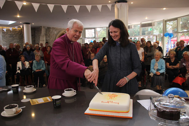 The Bishop and the Vicar cut the cake