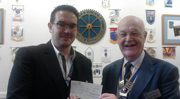 Boscombe and Southbourne Rotary Club President Brian Tuffrey presents Barry Wilson from Bournemouth Hospital Charity with the proceeds from last year’s event.