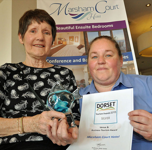 FAMILY HONOUR: Rosie Wallace (right) and her mother Jennie Deavin cradle their Dorset Tourism Award 